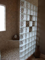 mosaic tile floor on the shower with larger tile interior walls 