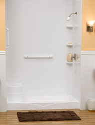 shower pan with an integral bench seat and safety grab bar in a white color 