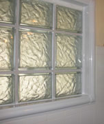 interior acrylic trim used around a glass block shower window 