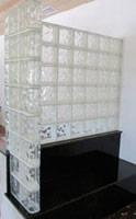 glass block half wall on a granite bench seat 