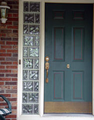 Glass block sidelights around a front door 