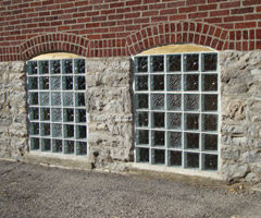 church basement windows with a decorative cross