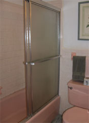 old cast iron bathtub with sliding glass doors 