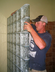 thinner series glass block shower wall being installed by a DIY 