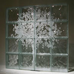 etched window with a tree mural 