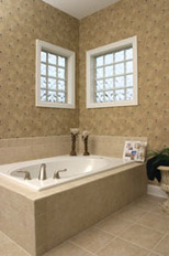 vinyl framed glass block windows above a soaking tub