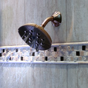 wall mounted shower head in a tile shower in cleveland 