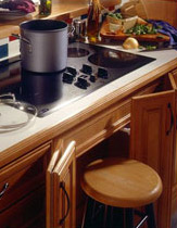 Smooth cooktop with roll out stool makes it easy to move hot items off the stove