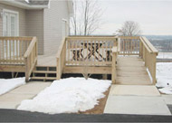 Outdoor deck and ramp combination for handicap entrance