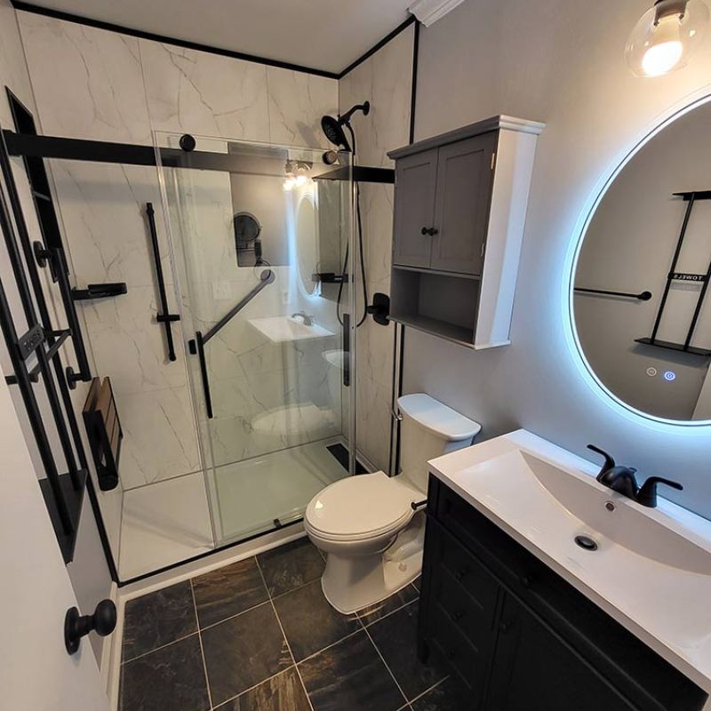 AFTER - Bianco marble wall panels, matte black trim, new vanity