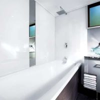 Arctic white bathtub surrounds in a contemporary bathroom 
