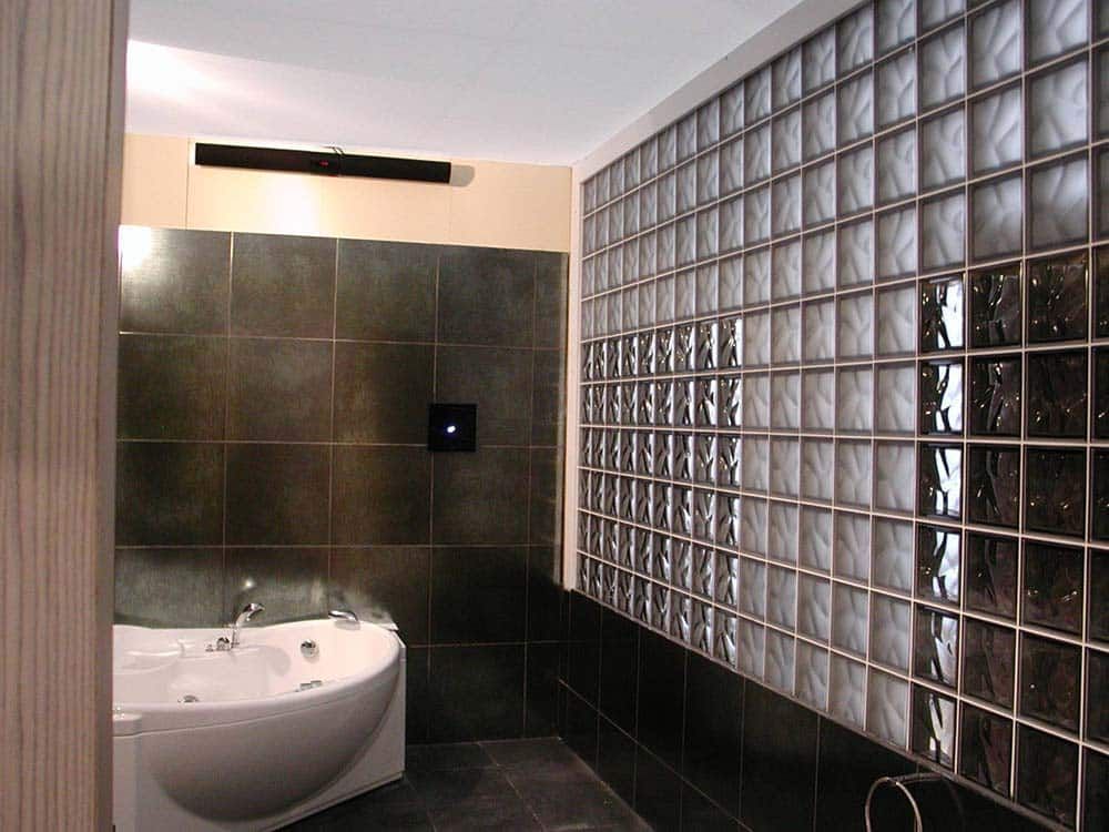 Bronze and frosted glass blocks in a tiled bathroom - Innovate Building Solutions 