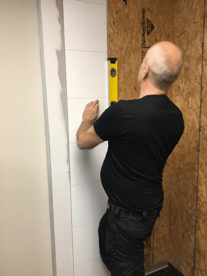 Tile pattern laminate shower panel installed direct to stud | Innovate Building Solutions | #TilePattern #BathroomWallPanels #LaminateWallPanels