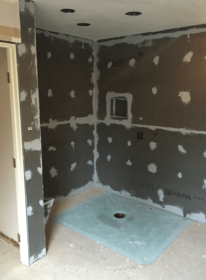 One level wet room during installation | Innovate Building Solutions | Innovate Builders Blog | #RollInShower #BathroomRemodel #Installation