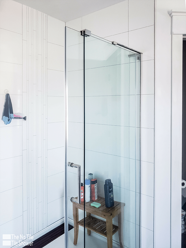 ungrouted laminate shower panels iwth a decorative white accent trim | Innovate Building Solutions | Innovate Builders Blog | #laminatewallpanels #bathroomRemodeling #ContractorIndustry