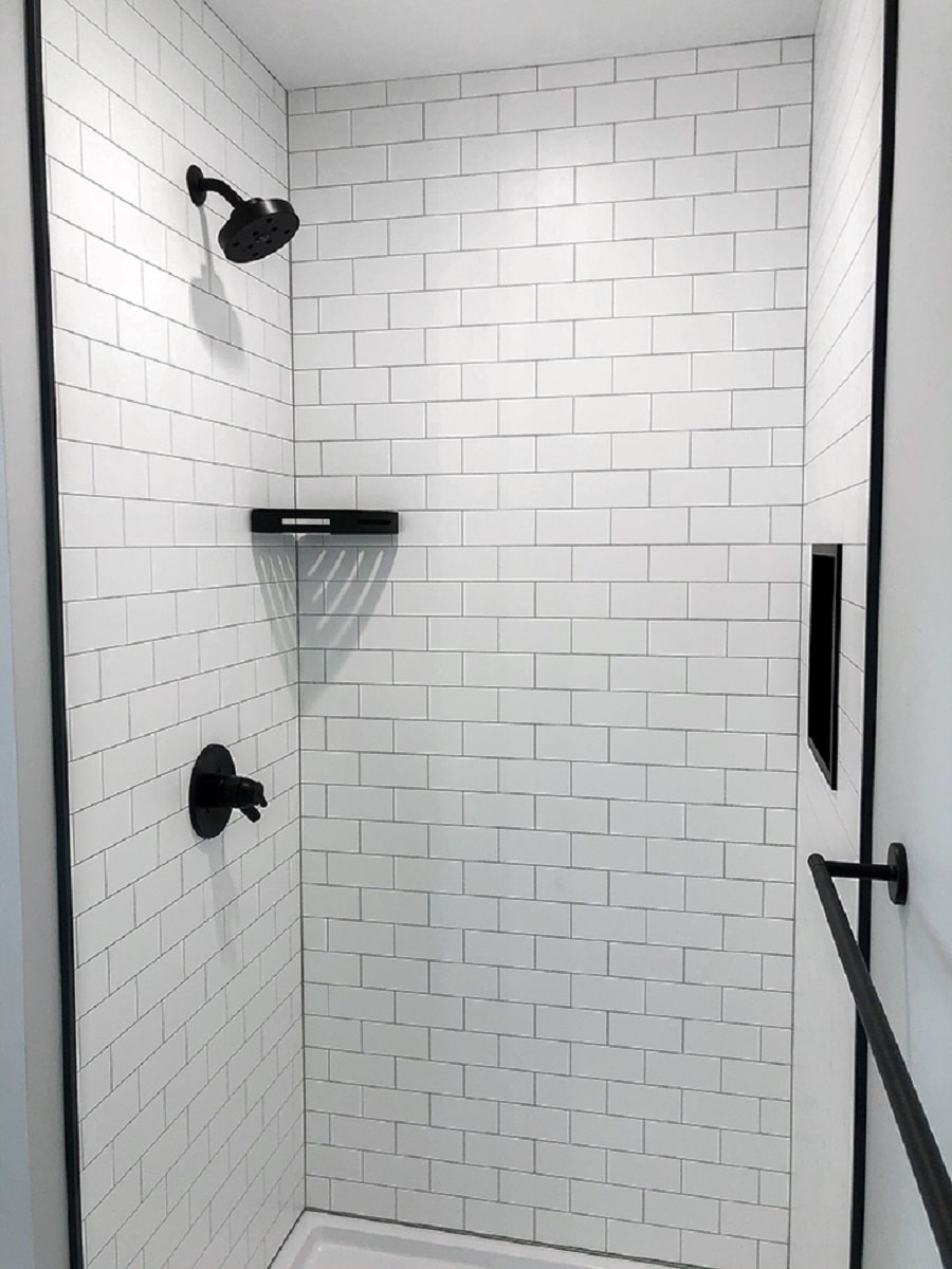 Con 6 matte finish white subway tile laminate shower wall panels | Innovate Building Solutions #ShowerHardware #BrushNickelHardware #BathroomRemodel