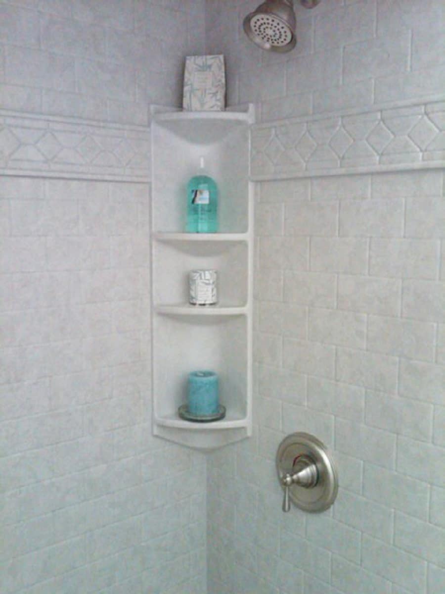 Con 7 acrylic double corner caddies look fake | Innovate Building Solutions #ShowerAccessories #BathroomRemodel #ShowerWalls