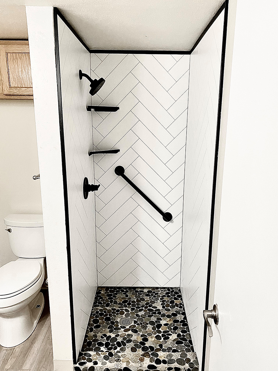 Tip 4 mosaic tile pan with grout free white herringbone wall panels | Innovate Building Solutions | bathroom Remodeling | Home Improvement