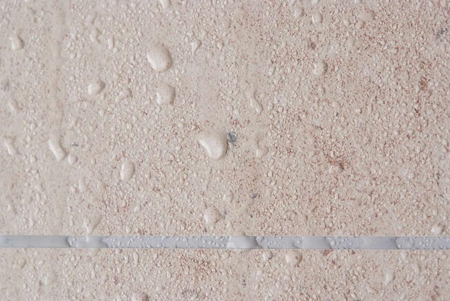 Criterion 1 realistic fibo panel water on faux grout joint | Innovate Building Solutions | Realistic Wall Panels | Tile Pattern | Laminate waterproof wall panels