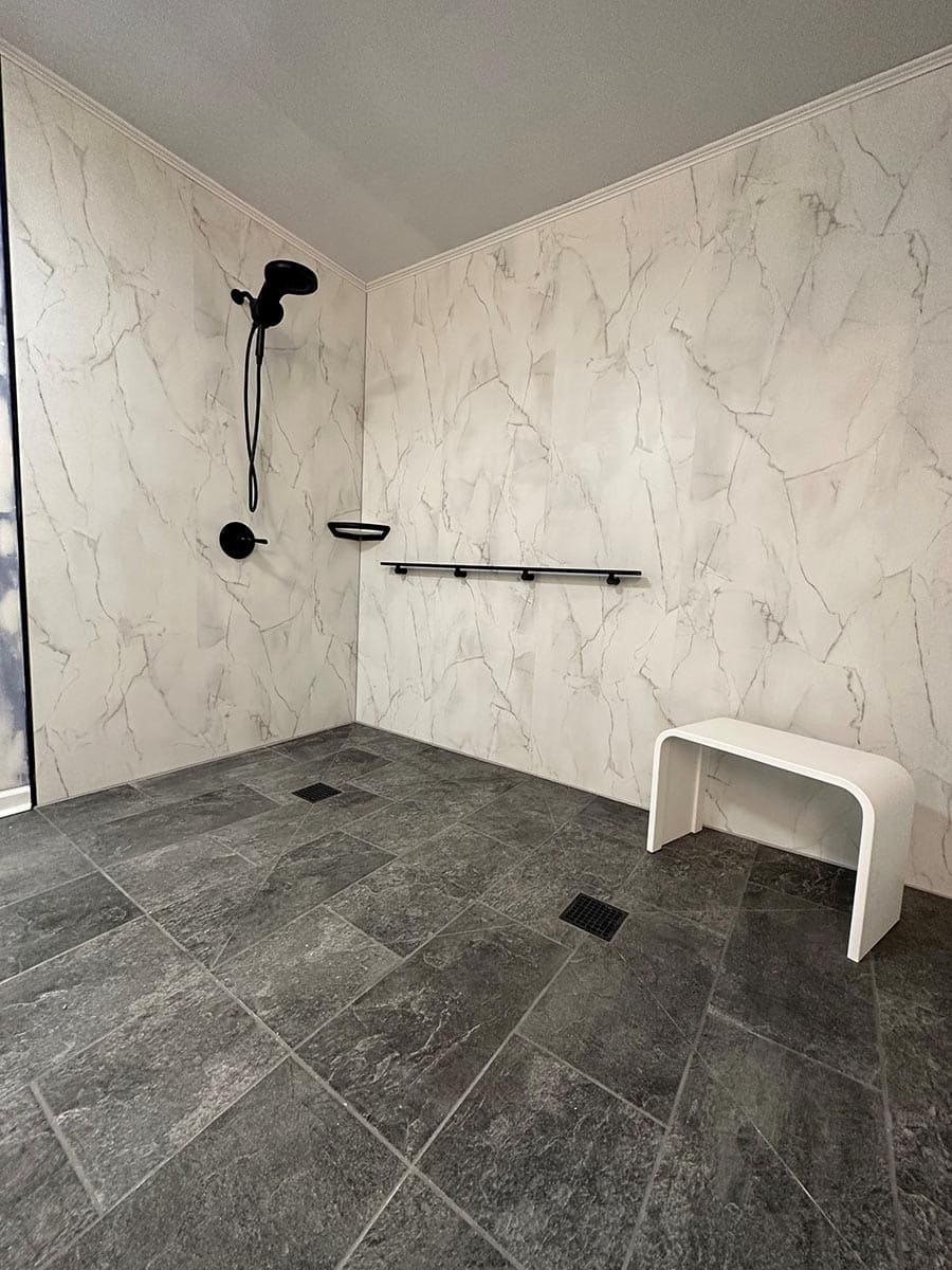 Reason 4 bianco marble wall panels in wet room credit JTEK Solutions Group | Innovate Building Solutions | Bianco Marble | Bathroom Remodel ideas | shower design tips | Large bathroom | Handicap Accessible Bathroom