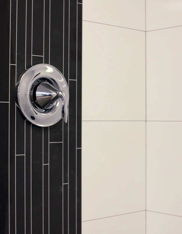 Laminate bathroom wall panels give a real tile or stone look without lower costs