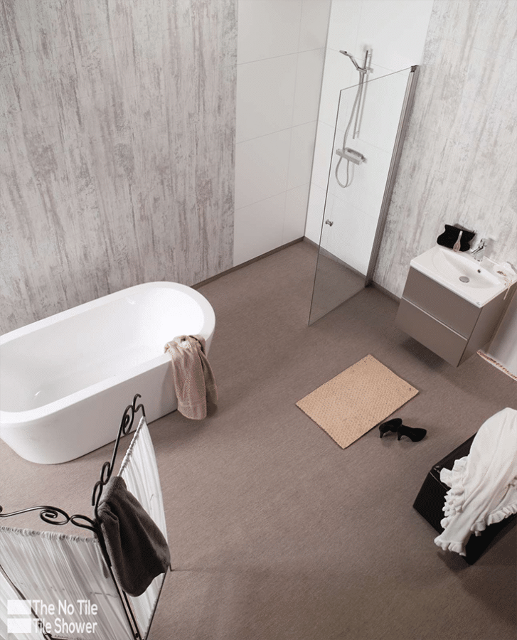 laminate shower panels antique gray hotel bathroom | Innovate Building Solutions | Innovate Multi Unit | #LaminateWallPanels #ShowerPanels #GroutFreePanels