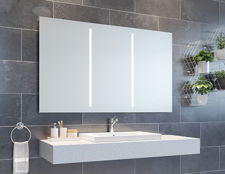 Mirrored medicine cabinet more storage better lighting vacation home rental bathroom | Innovate Building Solutions  | Luxury Apartments | #LuxuryRentals #ApartmentRentals #BathroomMirror #LEDMIrror