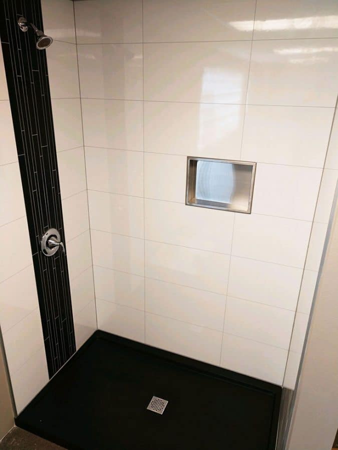 Laminate shower wall panels for a modular offsite built home | Innovate Building Solutions | Innovate Multi Unit  | #Laminatewallpanels #Showerwallpanels #ModularHomeBathrooms #OffsiteBuiltHome