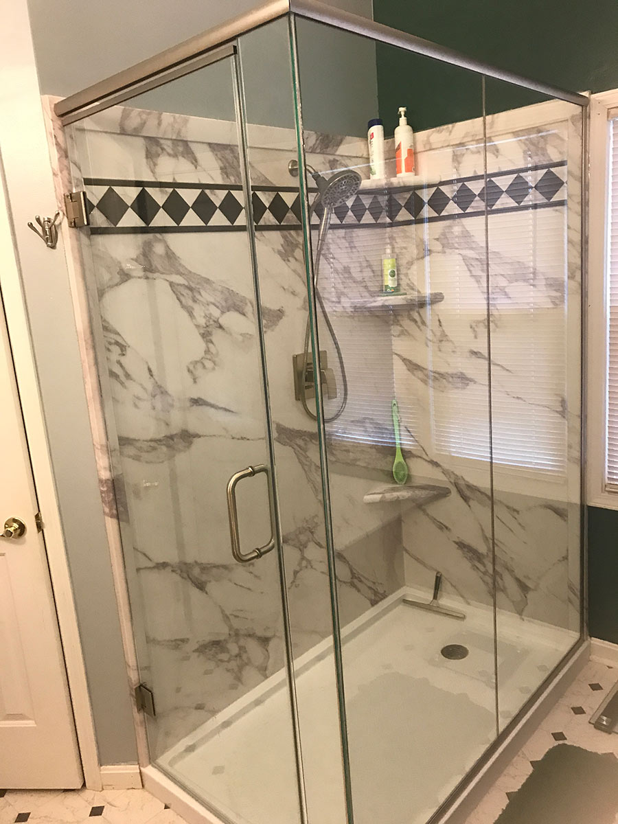 Custom size corner shower with PVC composite white marble wall panels | Innovate Building Solutions | #customshower #pvcShower #Bathroomshower