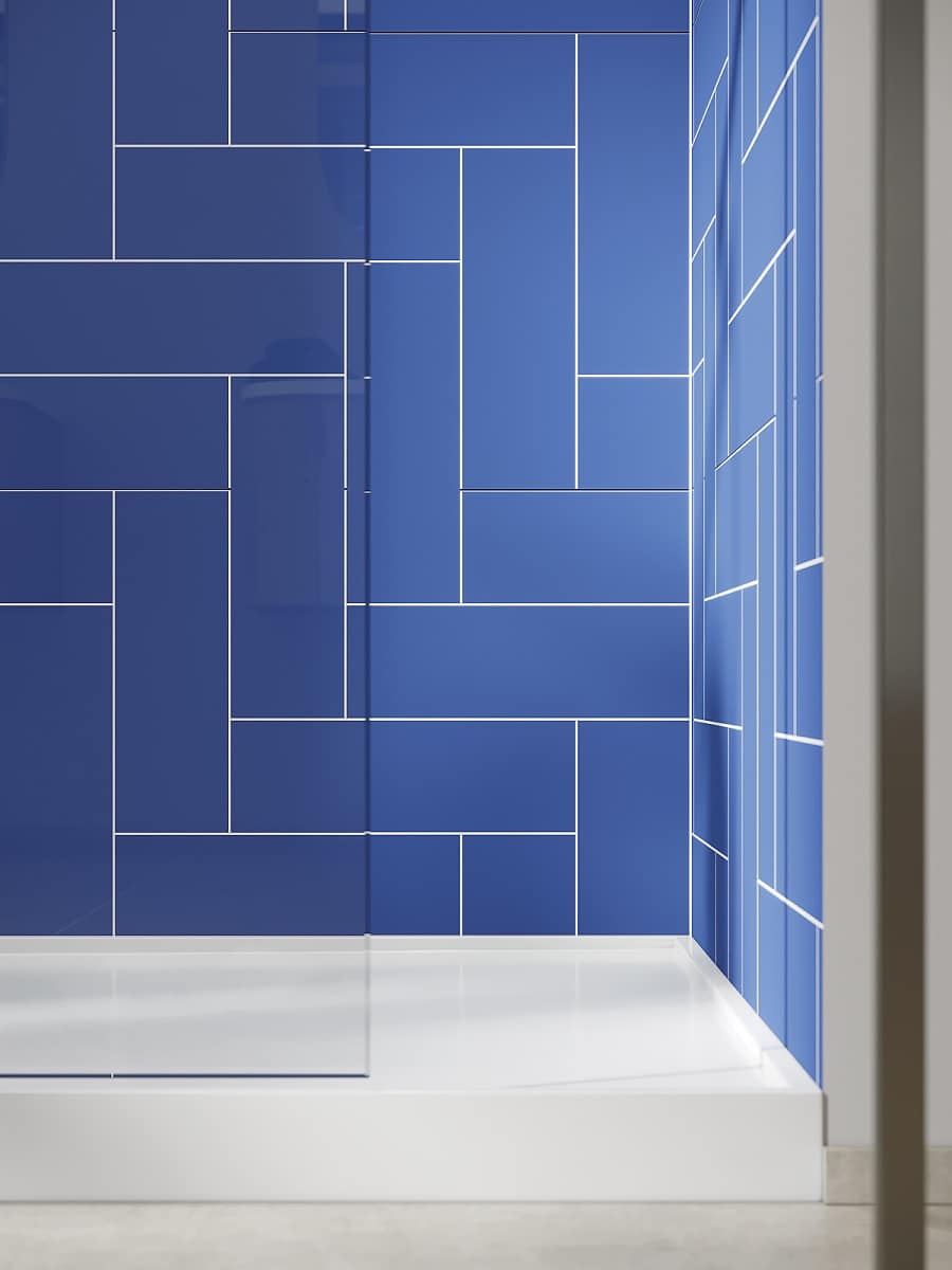 Criterion 9 - 90 degree ocean blue laminate wall panels upscale hotel | Innovate Building Solutions #HerringboneOceanBlueShowerWallPanels #ShowerPans #LaminateShowerWallPanels