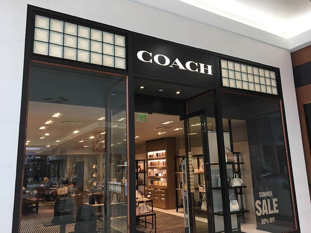 Circular focus prefabricated glass blocks in a Coach retail store - Innovate Building Solutions 