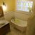 High privacy yellow color glass block bathroom window in a vintage  style bathroom with 8 x 8 and 4 x 8 sizes Parma Ohio - The Bath Doctor and Cleveland Glass Block 