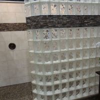 Glass block wall on a tile ready base with tile surrounds and a decorative border - Innovate Building Solutions 