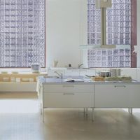 Euro styled kitchen with glass block window walls - Innovate Building Solutions 