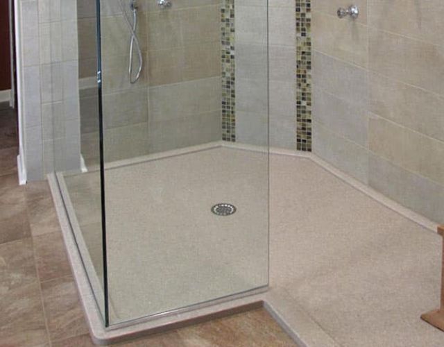 Custom walk-in low profile shower made of cultured granite 