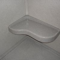 Rounded extended solid surface corner seat 18" x 24" with a curved design 