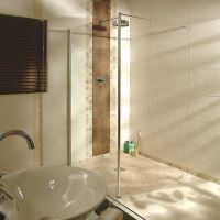 Roll in ADA accessible shower with a mosaic tile floor and waterproof bathroom - Innovate Building Solutions 