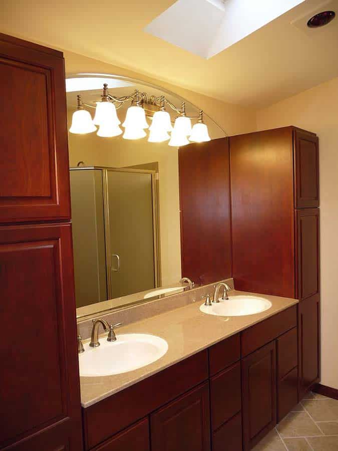 Cultured granite double bowl vanity countertop with a while sink and traditional faucets in Seven Hills Ohio - The Bath Doctor 
