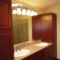 Traditional bathroom vanity with a solid surface countertop and double bowl sink in Old Brooklyn Cleveland  - The Bath Doctor and Innovate Building Solutions 