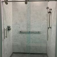 Accessible shower with a cultured granite shower pan with laminate 24 x 24 shower panels - The Bath Doctor Shaker Heights 