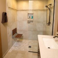 One level age in place shower with a teak fold down seat - The Bath Doctor Brecksville Ohio 