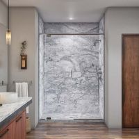 Decorative marble looking grout free shower wall panels with a barn door sliding glass door - The Bath Doctor Solon Ohio 
