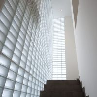 Frosted half-sized glass blocks in a modern stairwell - Innovate Building Solutions 