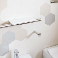Contemporary bright chrome grab bar with a Corian shelf for soap - Innovate Building Solutions 