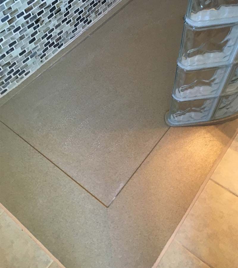 Ramped cultured granite shower pan with a premade glass block curved wall - The Bath Doctor and Innovate Building Solutions - Highland Heights Ohio 