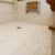 Close up ADA shower with a one level tile floor by The Bath Doctor Cleveland Heights Ohio 