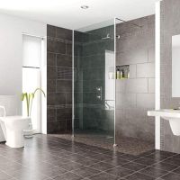 Roll in shower with a shower screen in a chrome finish - Innovate Building Solutions 