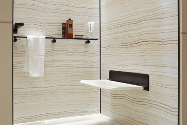 Fold down seats and grab bars in an upscale barrier free shower - The Bath Doctor 