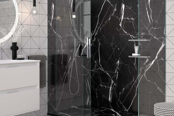 Black marble shower pan and grout free walls in a modern bathroom
