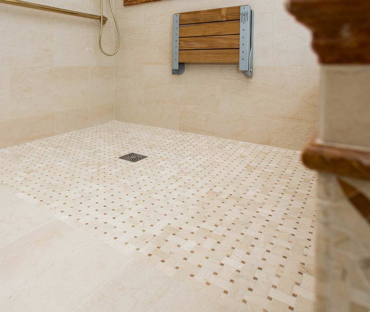 Close up ADA shower with a one level tile floor by The Bath Doctor Cleveland Heights Ohio 